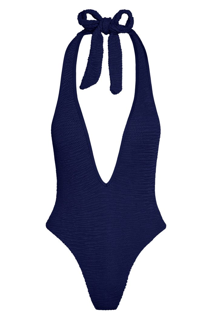 Front of Cyprus One Piece in Midnight Crinkle, halter plunge V-neck with tie and textured fabric, high-leg cheeky cut on white