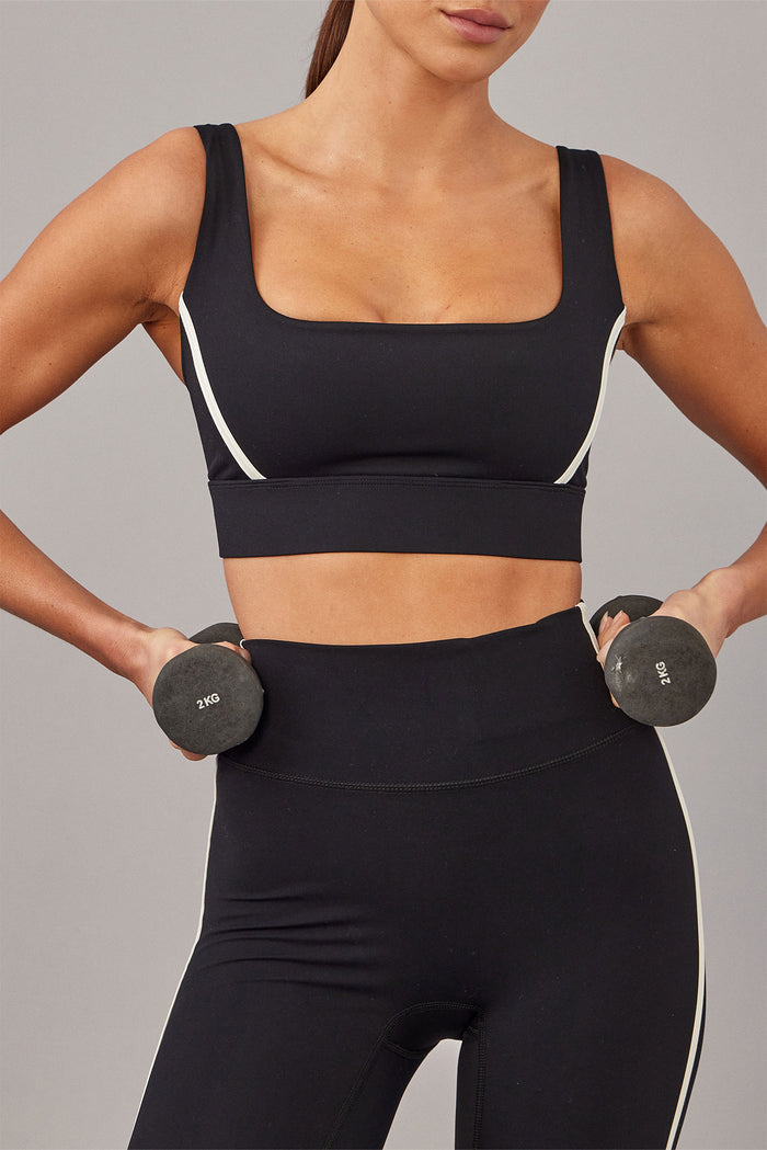 Front of Devin Bra in black/ivory showing square neckline, wide straps, and ivory side piping