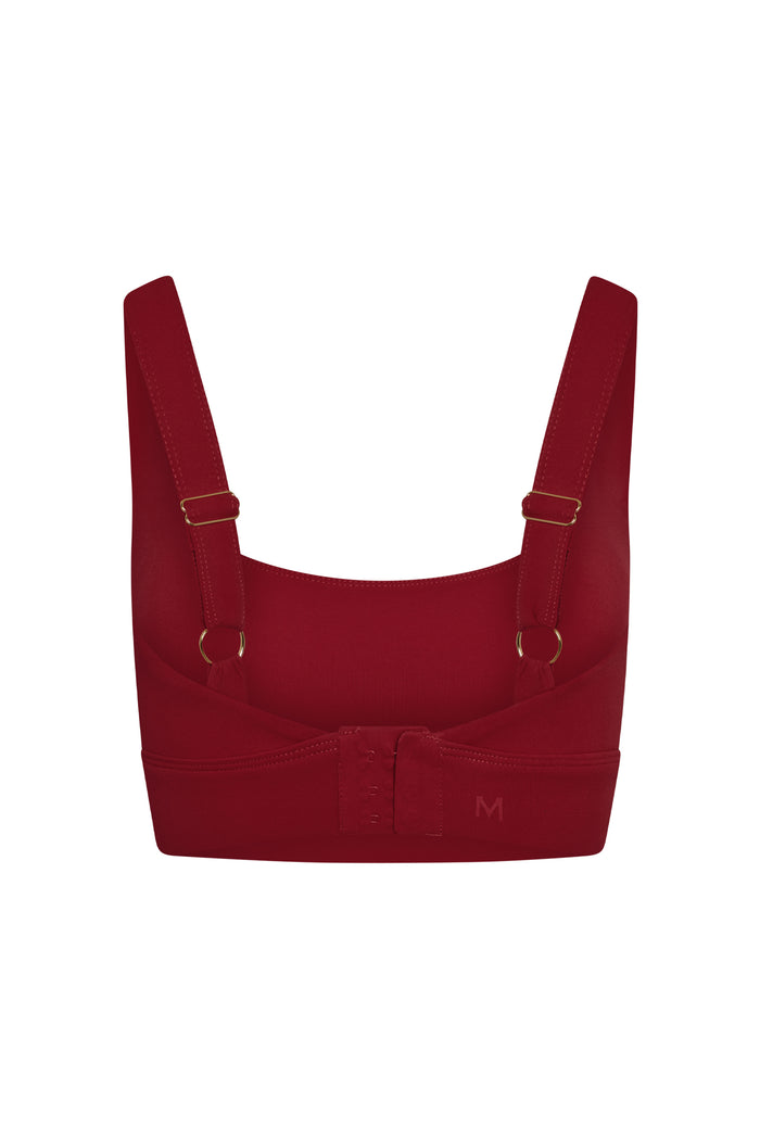 Front close-up of the Devin Bra in Cherry showcasing scoop neckline, adjustable straps, and hook-and-eye back closure on white background