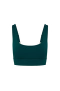 Front view of Denali “The Devin Bra” in Evergreen showing scoop neckline, wide supportive straps, and wide underband on white background