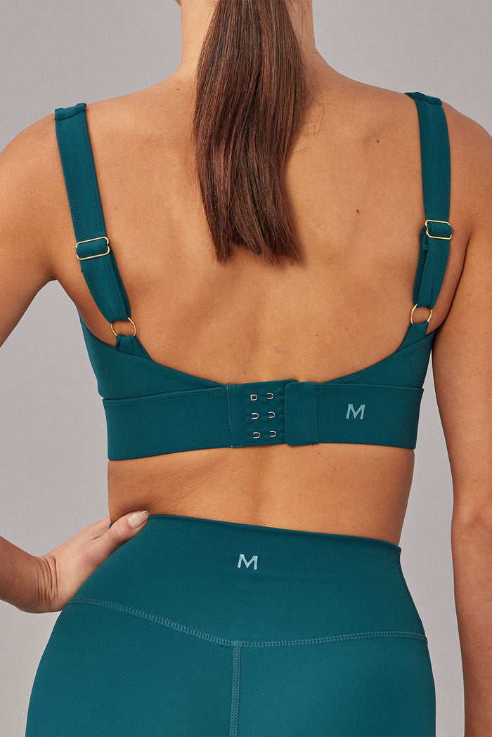 Back view of Devin Bra in Evergreen showing adjustable straps and three-row hook-and-eye back closure