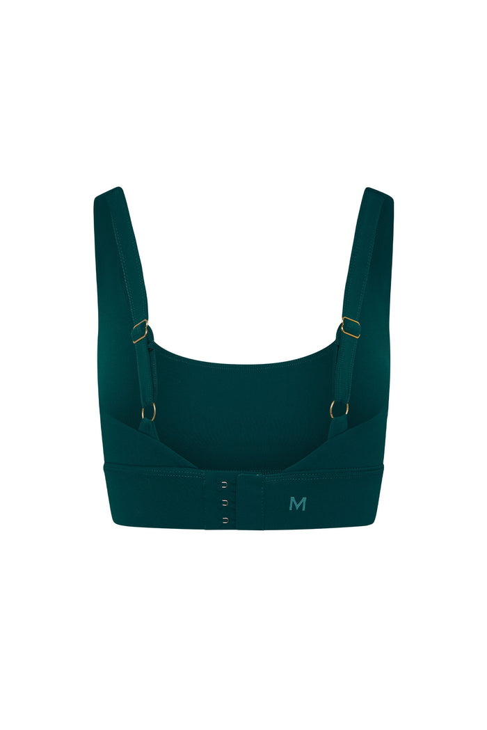 Back view of The Devin Bra in Evergreen showcasing adjustable straps and three-row hook-and-eye closure on white background