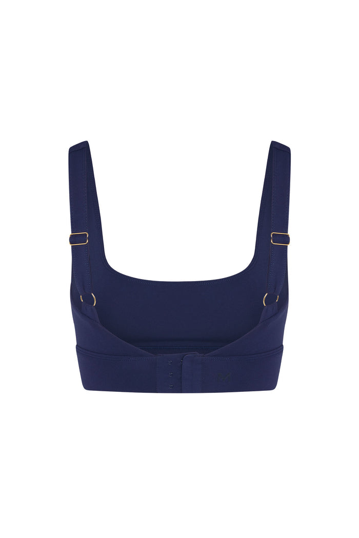 Back view of the Devin Bra in midnight with adjustable straps, gold hardware and hook-and-eye back closure on white background