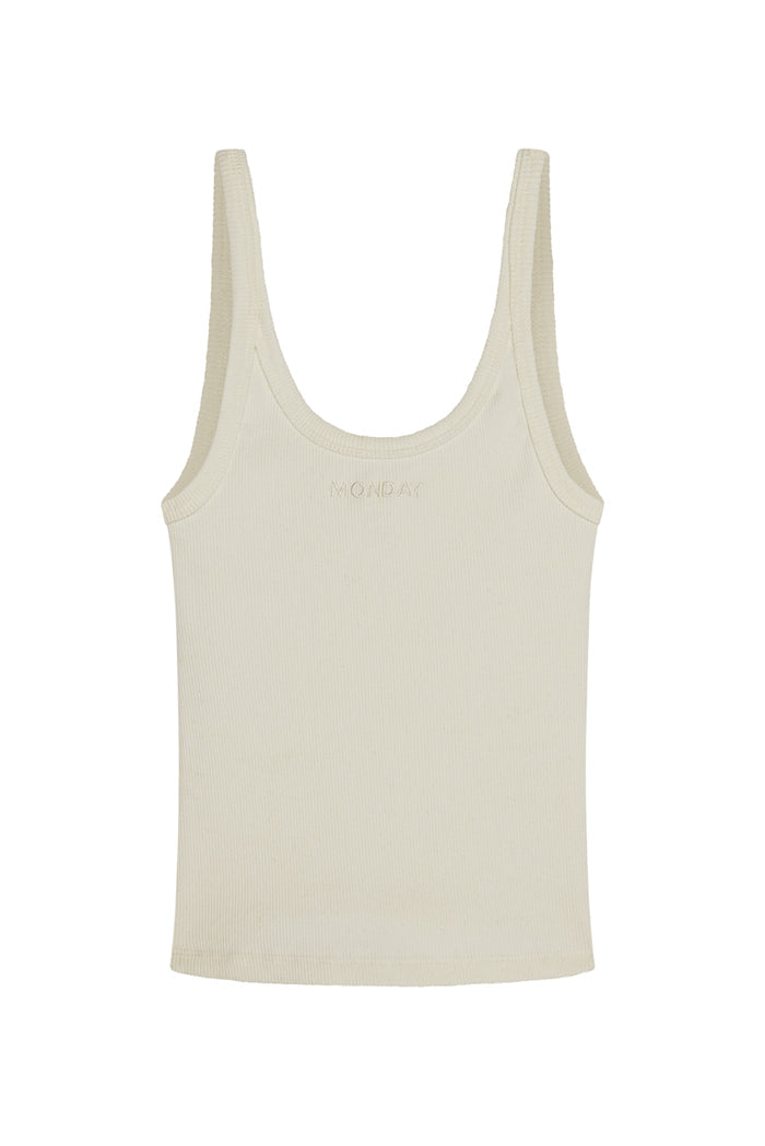 Flat lay of Devin Tank Crop in Ivory Rib showing scoop neckline, ribbed texture, and tonal MONDAY embroidery on white background