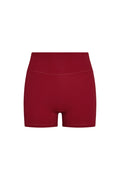 Front view of Elysian Short in cherry showing high doubled waistband, booty short cut with front pocket on white background
