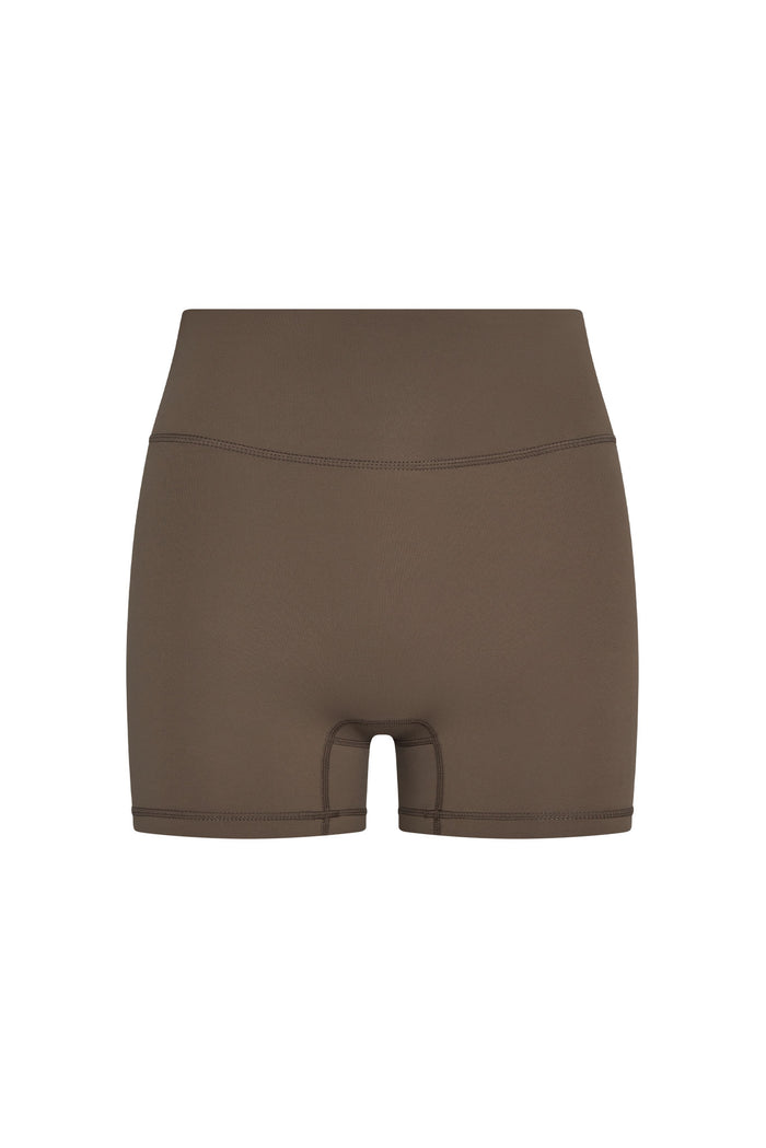 Front view of Elysian Short in stone jersey showcasing high-rise wide waistband and short fitted legs on white background