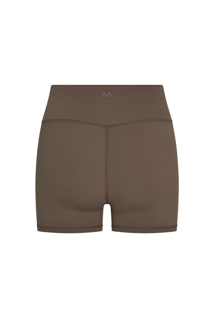 Back view of Elysian Short in stone jersey showcasing high-rise waistband and center-back seam on white background