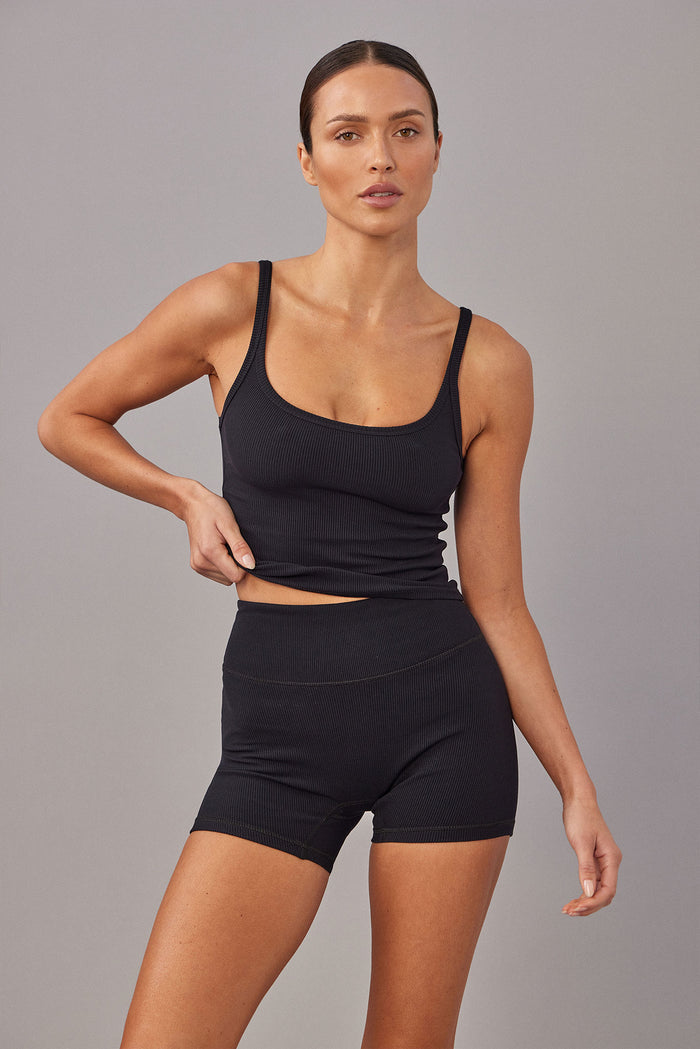 Front view of Elysian Short 4.5 inch in Black Lightweight Rib showcasing high-waist ribbed biker shorts on gray background