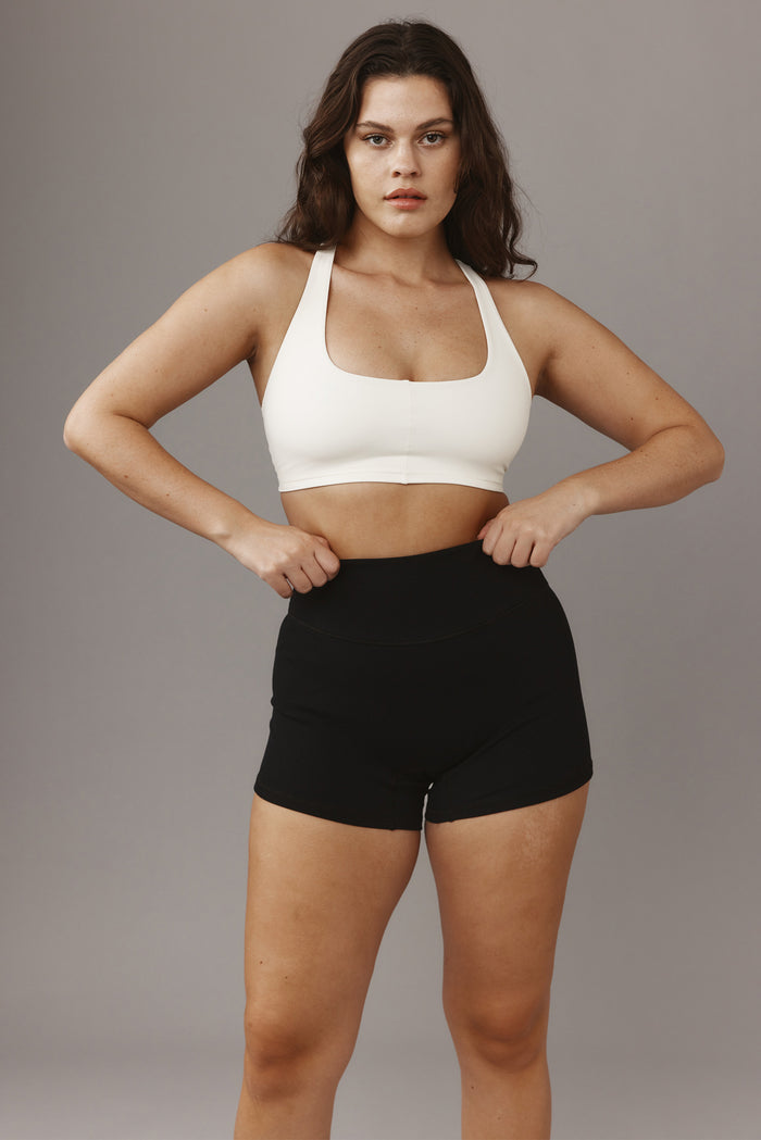 Front view of Elysian Short 4.5 inch in Black Lightweight Rib showing high-waist fit and doubled waistband on gray background
