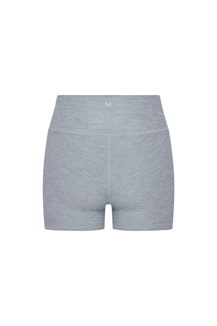 Back view of Elysian Short 4.5 inch heather grey showing high-rise waistband, center seam and small M logo on white