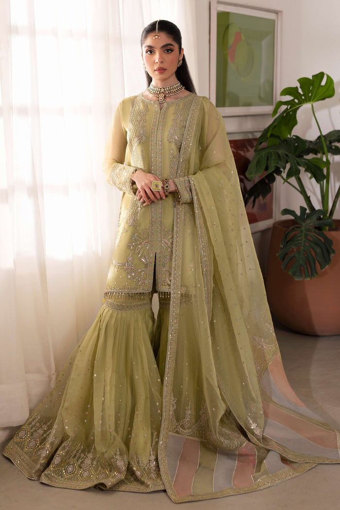 Naqshi eraj dusty‑lime organza short shirt with crystal‑embellished boat neckline, pastel‑tone sequin embroidery from neckline to mid‑slit, paired with high‑waist organza gharara.