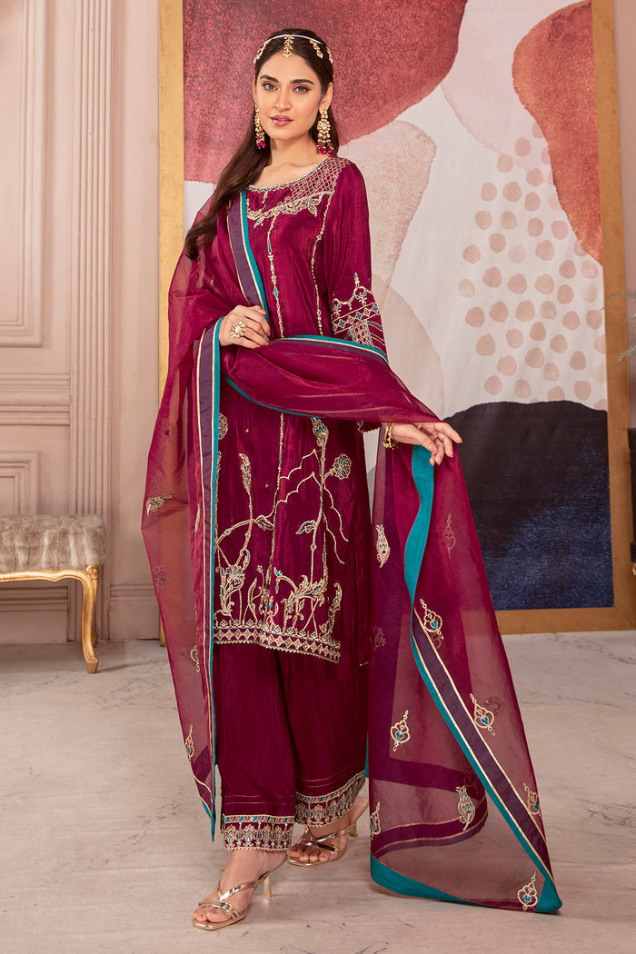 Standing pose of Erina burgundy pink dress showing flowing long shirt and culottes with embroidered borders, elegant ready made festive outfit.