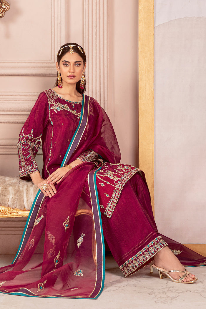 Seated pose of Erina burgundy pink festive dress showing detailed dupatta border and clean fall of shirt, ready to wear celebration outfit.