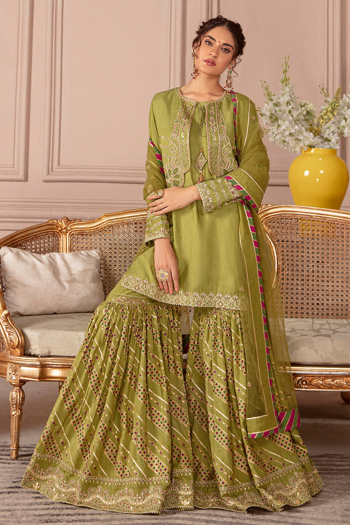 Standing pose of Eva green gharara suit showing flared embroidered gharara and layered jacket styling, elegant ready made festive outfit.