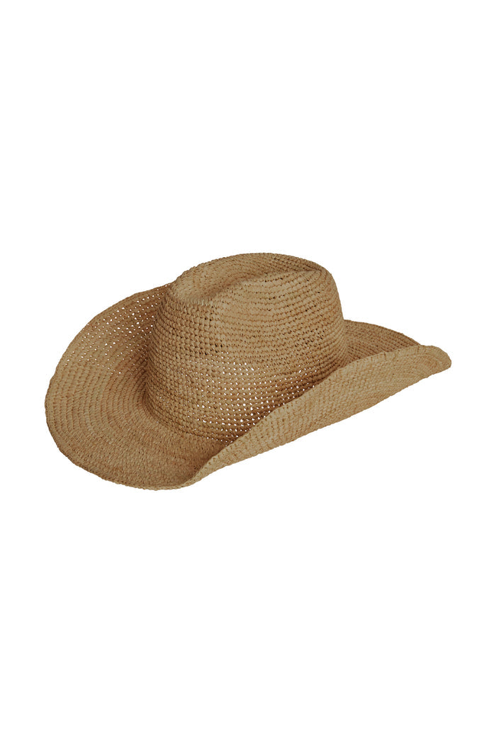 Angled front view of Exuma Raffia Hat in Husk showing woven straw, flexible wired brim and adjustable inner tie on white