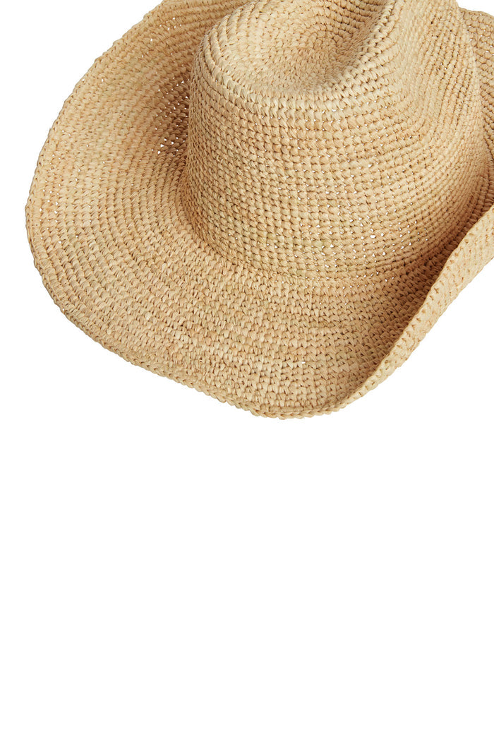 Close-up of Exuma Raffia Hat showing woven straw raffia texture and wide brim on white background