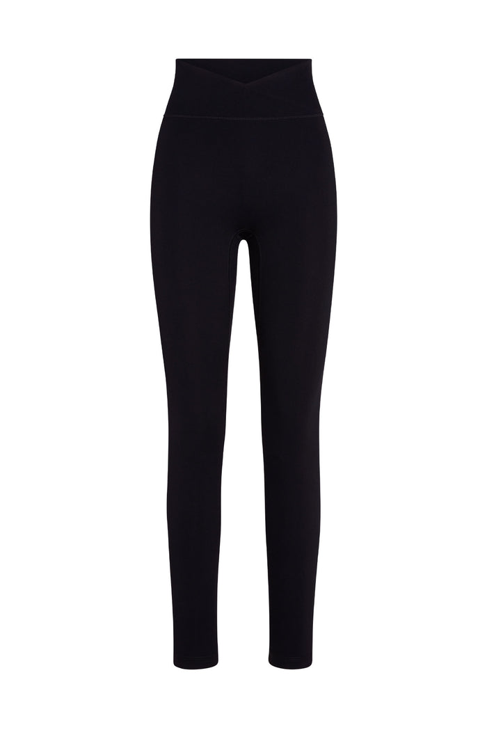 Black high-waist full-length leggings with V-shaped crossover waistband on white background