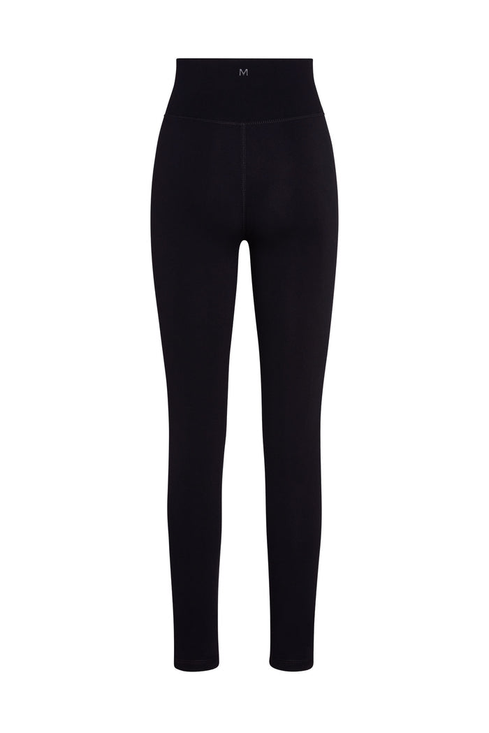 Front view of Fairfax Long Legging 29 inch in black with V-shaped crossover high waist, slim full length and small centered M logo on white background