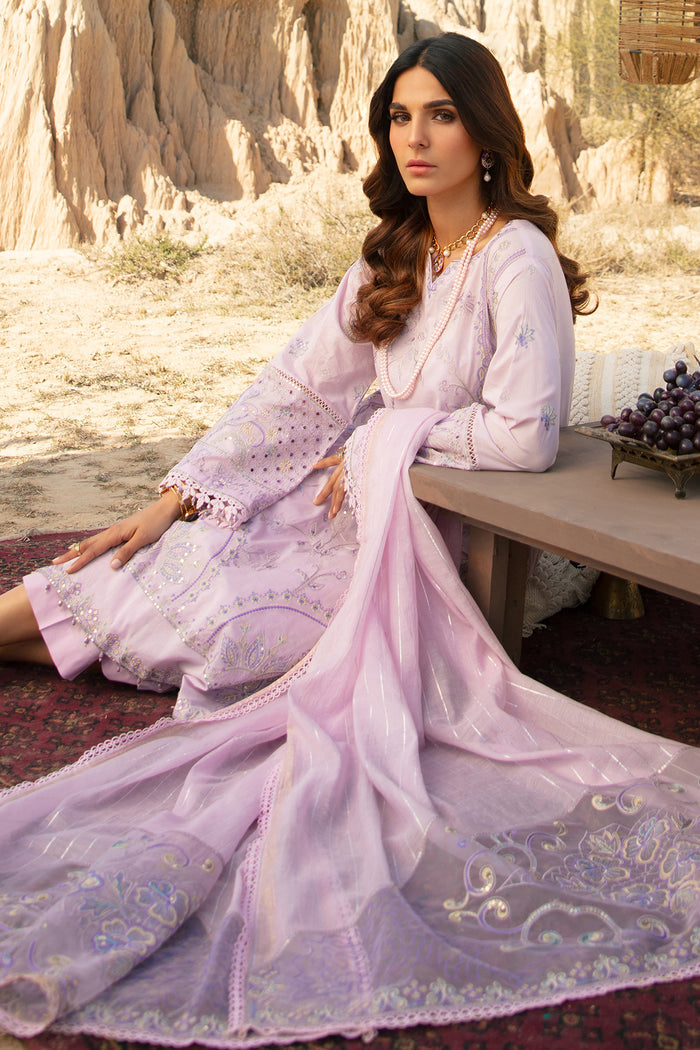 Model sitting wearing Farhang lavender 3 piece suit with embroidered dupatta and detailed hem suitable for Eid and family gatherings