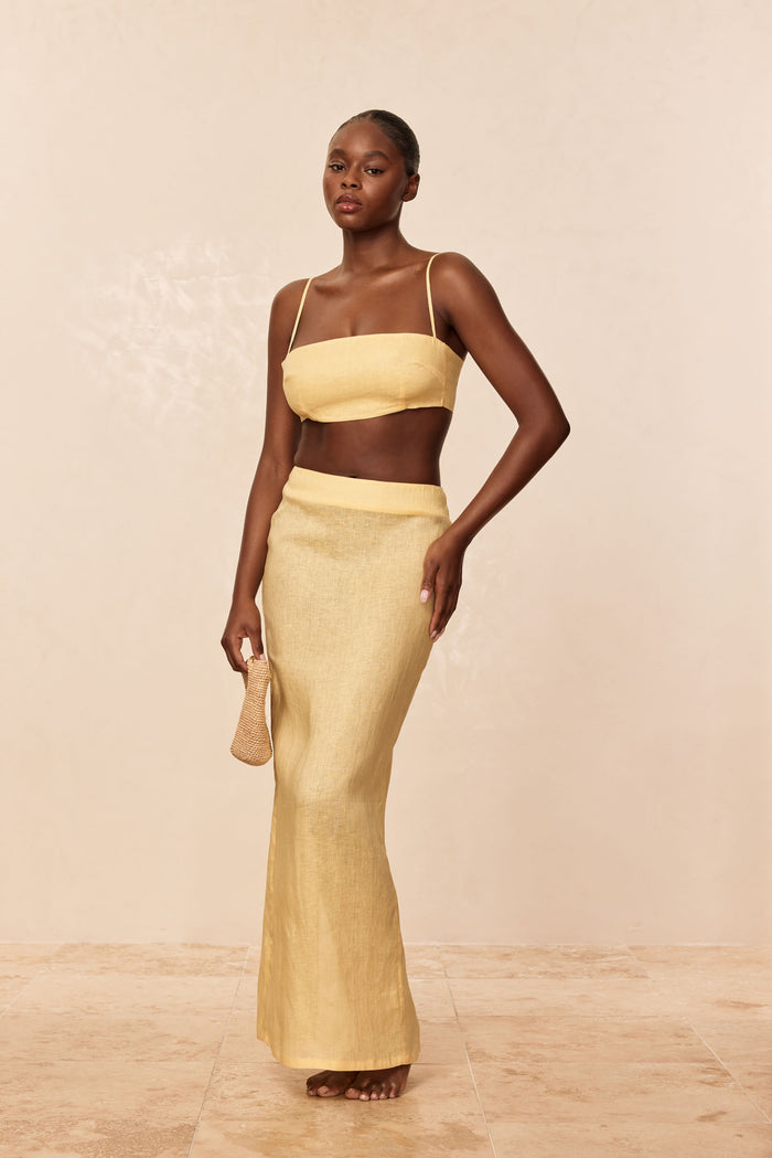 Front view of Fontelina Linen Skirt in Honey showcasing high-rise fitted waist and slim maxi silhouette on neutral background