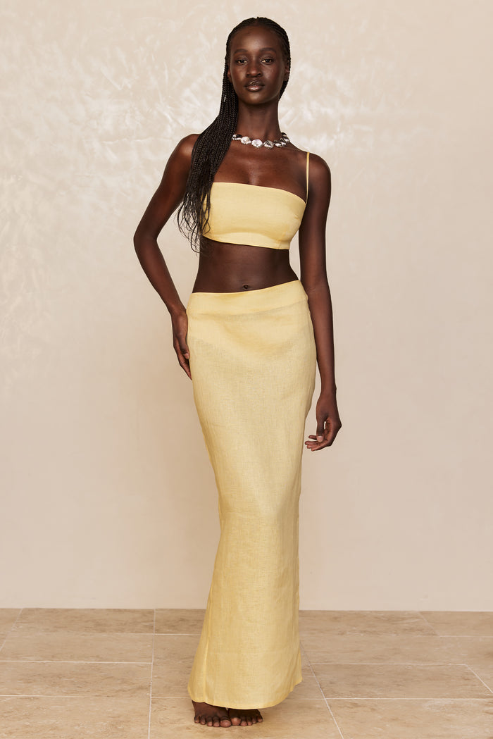 Front view of Fontelina linen skirt in Honey showing high waist and column silhouette on model against neutral background