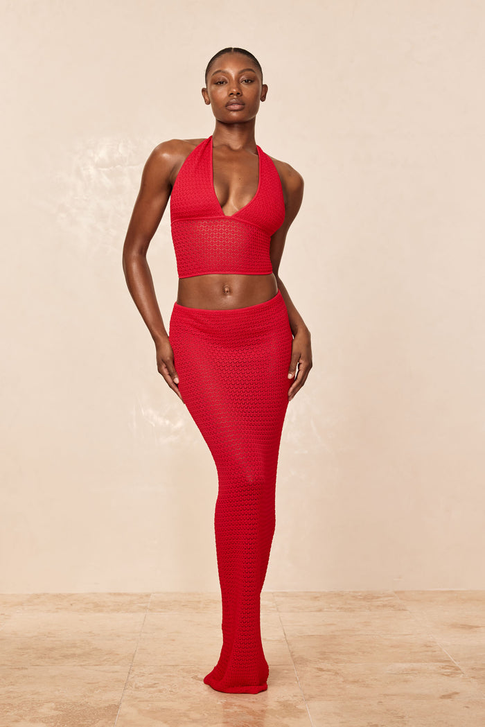 Full-length front of Fontelina Skirt in Chili Pepper lace crochet showcasing fitted open-knit semi-sheer maxi silhouette on beige backdrop