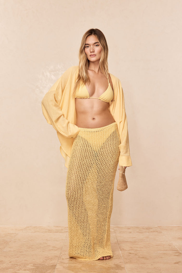 Front view of Fontelina skirt in Honey petit crochet showcasing open-knit maxi and high waist on model in beige studio