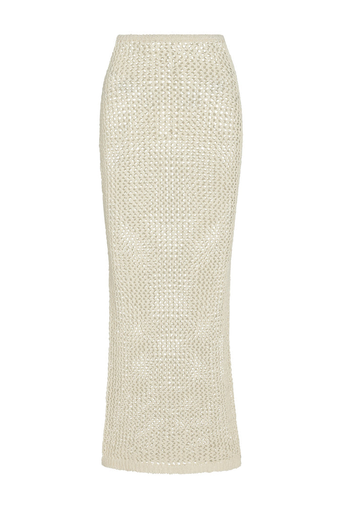 Front view of Fontelina skirt in ivory petit crochet, fitted waist, straight maxi silhouette, open knit on white background