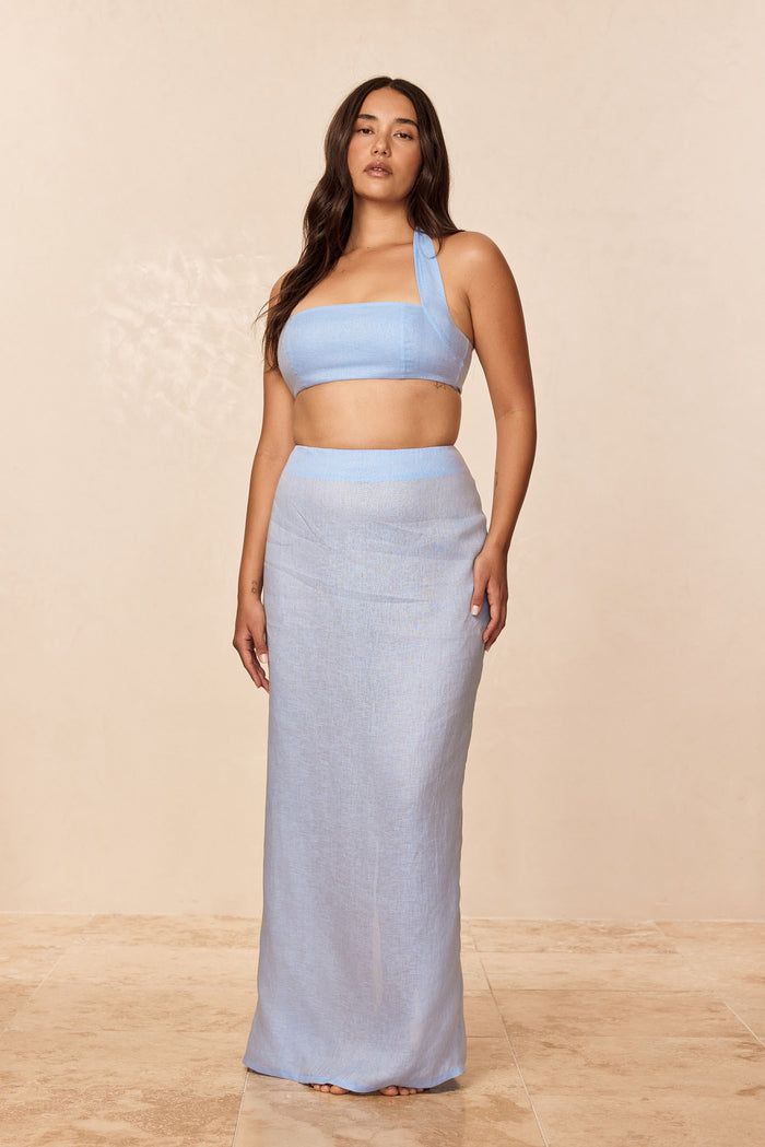 Front view of Fontelina skirt in Sky Linen showcasing high waist, full-length straight fit on model against beige background