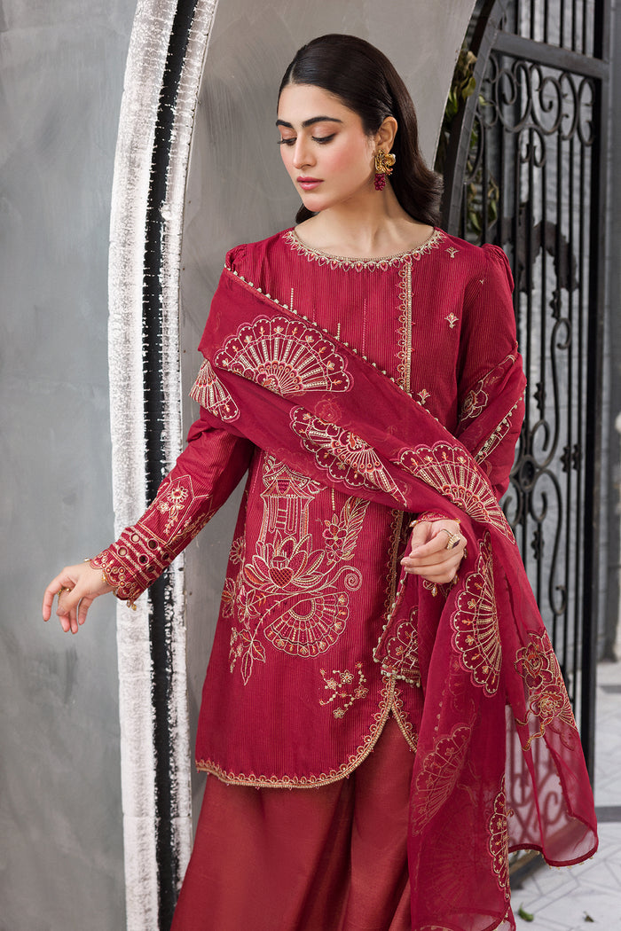 Model styling Gajra red sharara dress highlighting front panel embroidery