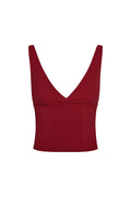 Front view of Glacier Tank in cherry showing deep V-neck, twisted front seam and adjustable over-the-shoulder straps on white background