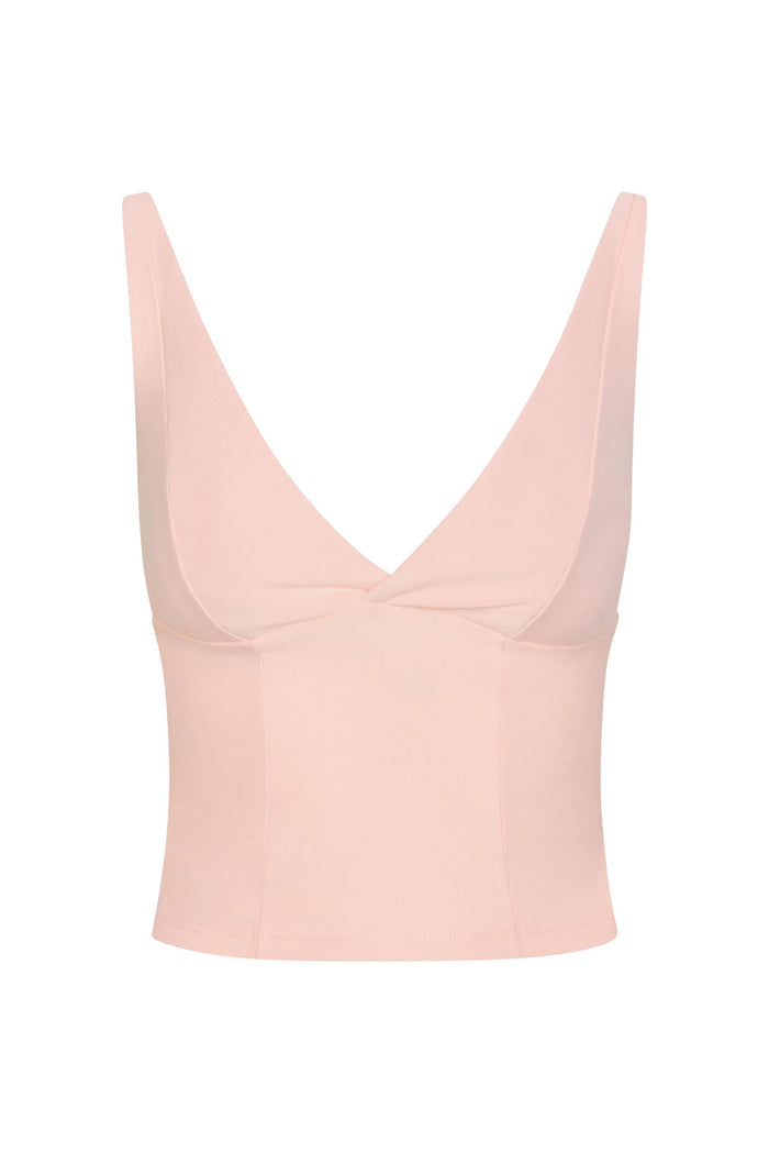 Front view of Glacier Tank in Heather Powder Pink — deep V-neck, crossover bust seam, wide adjustable straps