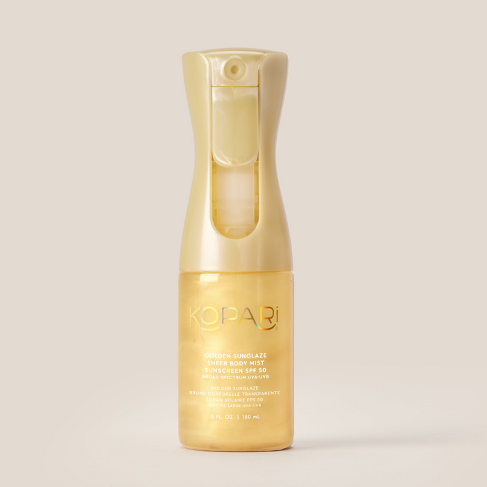 Front view of Kopari Golden Sunglaze SPF 50 body mist bottle showing gold spray top and shimmering golden liquid on beige background