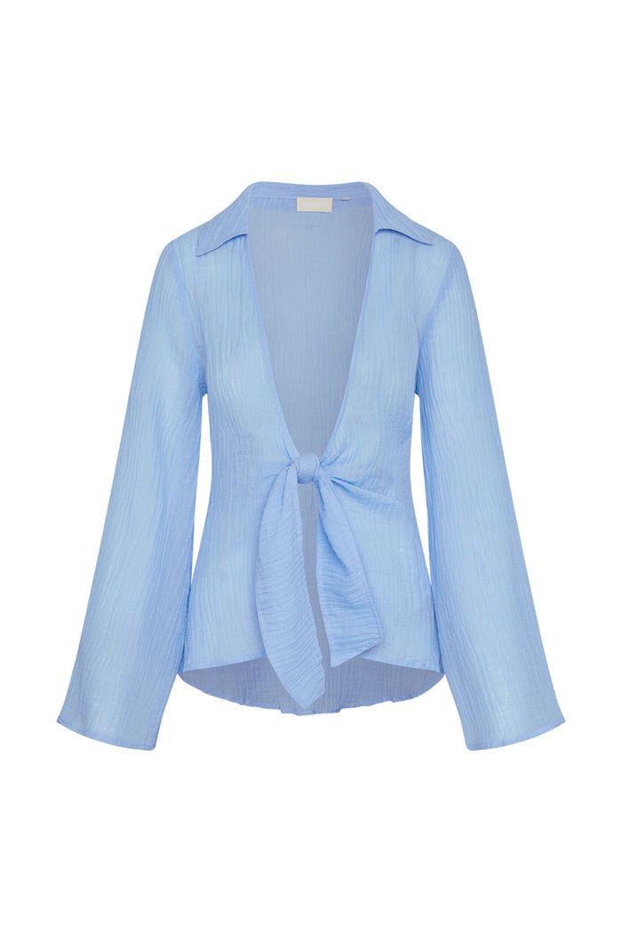 Front view of Grenada Tunic in Sky crinkle linen with deep V, front tie, long sleeves on white background