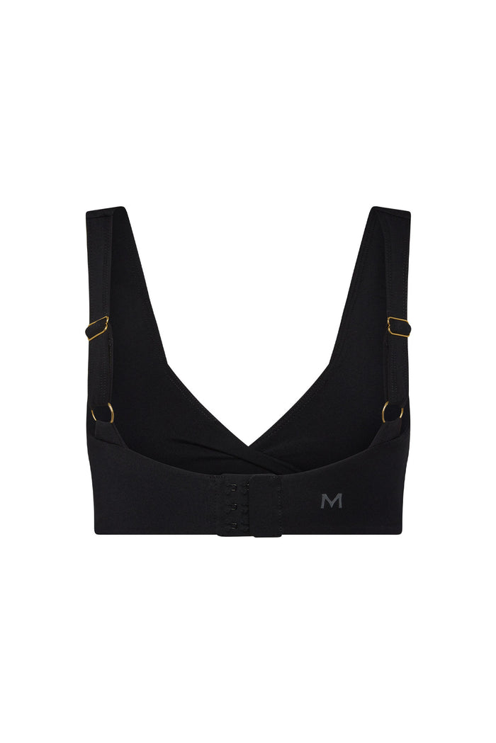 Front view of Griffith Bra in black showing twist V-neck, wide adjustable straps with gold hardware, hook-and-eye band on white