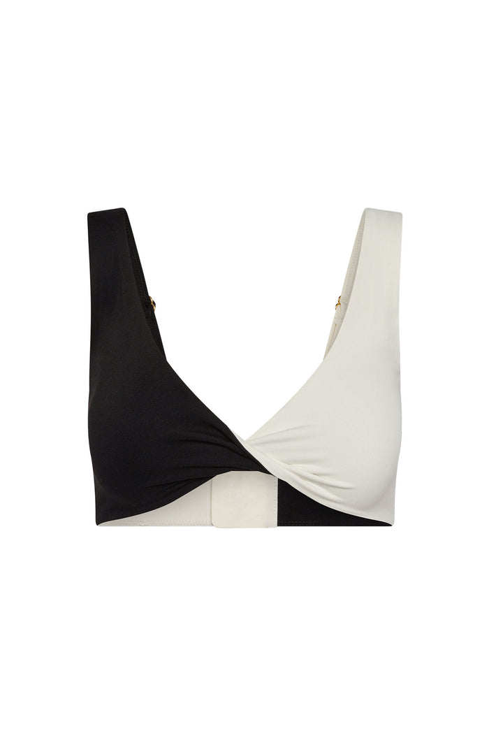 Two-tone black and white twist-front bikini top with wide straps and rectangular back closure