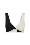 Two-tone black and white twist-front bikini top with wide straps and rectangular back closure
