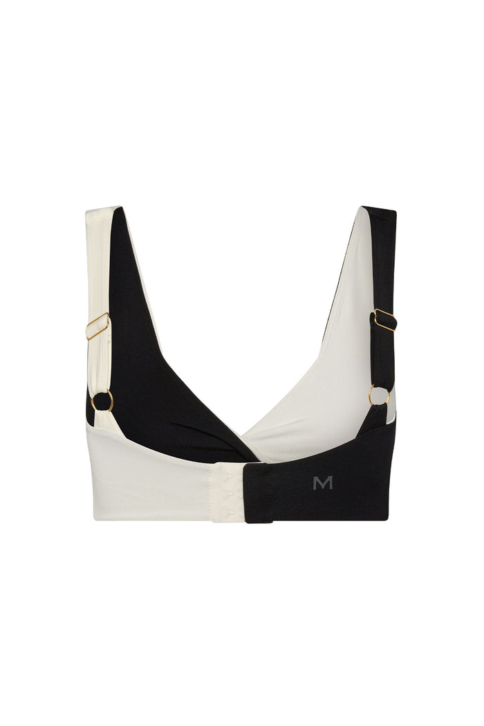 Front view of Griffith Bra in Black/Ivory with colorblock wrap, V-neck and adjustable straps with gold rings