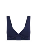 Front view of Griffith Bra in midnight jersey showcasing twist front neckline and adjustable straps on white background