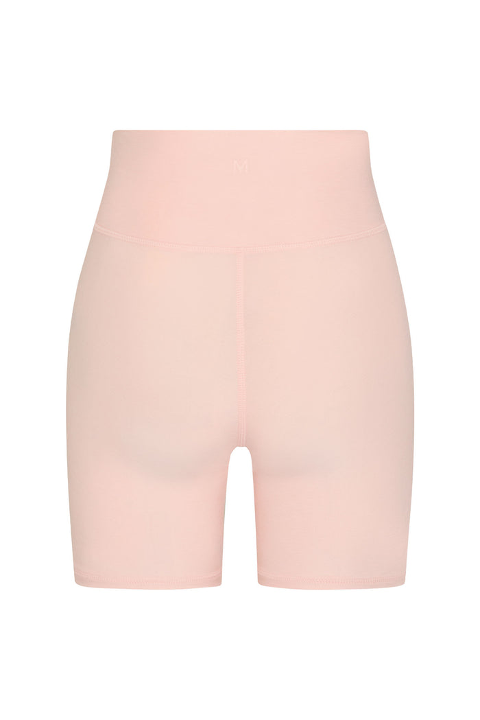 Back view of Griffith Short in Heather Powder Pink showing high doubled waistband, center back seam, and mid-thigh length on white background