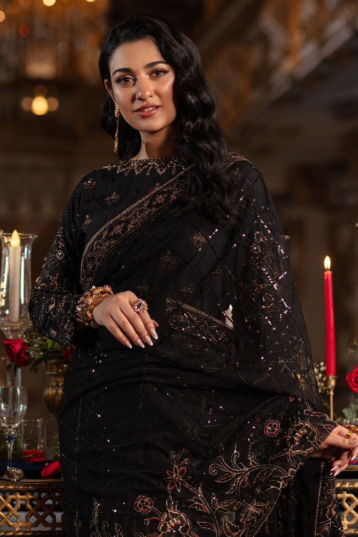 Close-up revealing Naqshi Hainoor blouse embroidery mix: hand‑adda, sequins, thread patterns & crystal hangings on black raw silk.