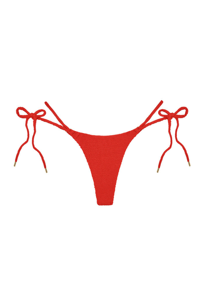 Front of Hanalei Bottom in Chili Pepper Crinkle showing tie-side adjustable straps, gold hardware and minimal coverage on white