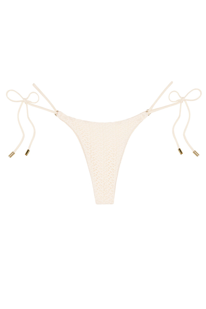 Front of Hanalei Bottom in Ivory Crochet, low-rise thong with adjustable side ties and gold hardware on white background