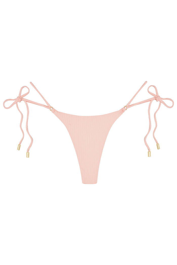 Front view of Hanalei Bottom in powder pink rib, tie sides, ribbed texture, minimal coverage, gold hardware on white