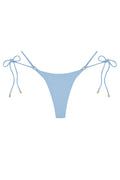 Front flat-lay of Hanalei Bottom in Sky Rib showing ribbed texture, adjustable tie sides with gold-tone hardware on white background