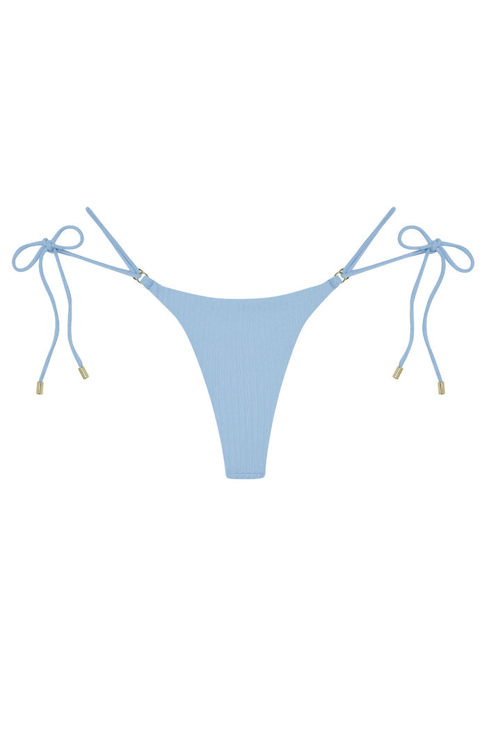 Front flat-lay of Hanalei Bottom in Sky Rib showing ribbed texture, adjustable tie sides with gold-tone hardware on white background