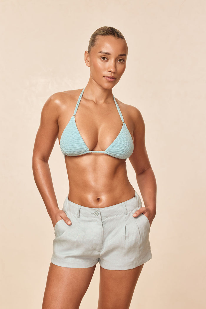 Front view of Hanalei Top in Light Slate Crinkle showcasing textured crinkle fabric and triangle halter cups with neutral beige backdrop
