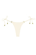 Cream-colored tie-side thong bikini bottom with gold-tone metal tip accents