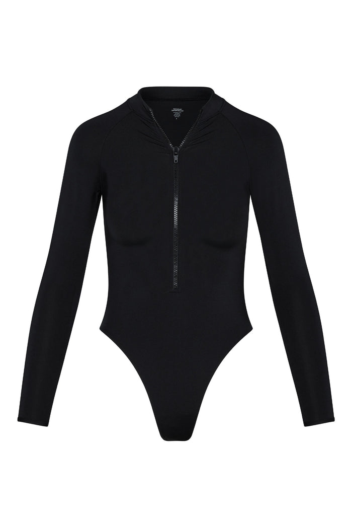 Front view of Hilo One Piece swimsuit in black with long sleeves, front zipper, mock collar, high-cut leg on white background