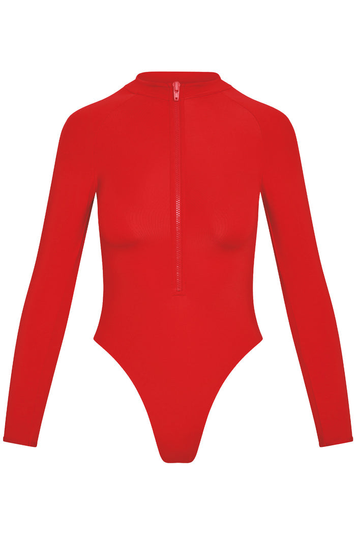 Front view of Hilo One Piece in Chili Pepper showcasing long sleeves, locking zip-front and high-cut leg on white background